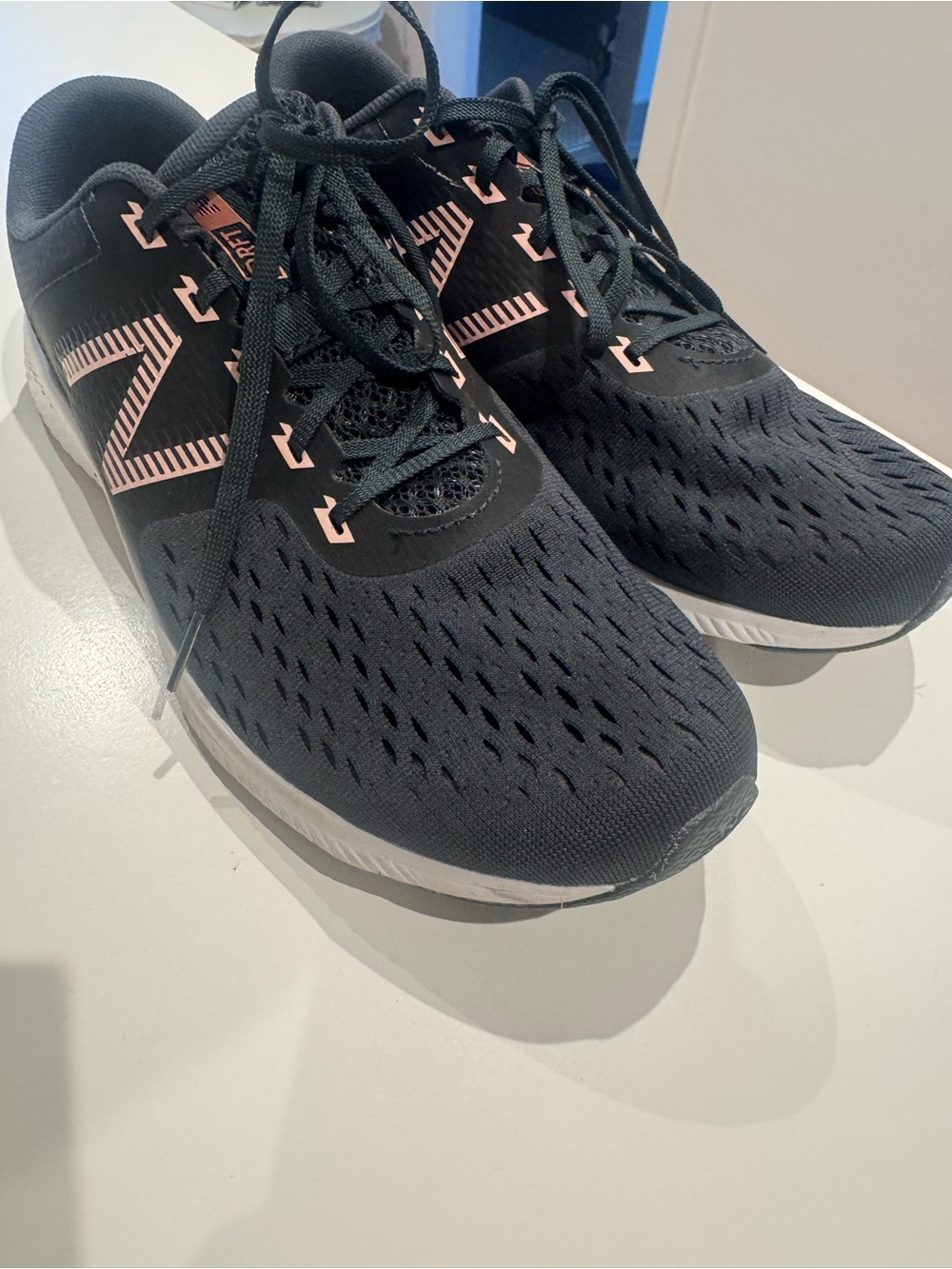 New Balance Black Athletic Shoes with Pink Accent Logo